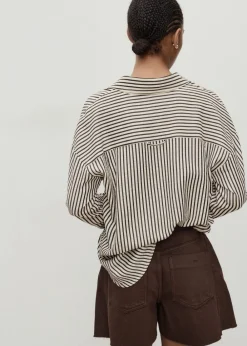 Dame MANGO Denim shorts with frayed hem and pl