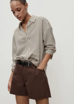 Dame MANGO Denim shorts with frayed hem and pl